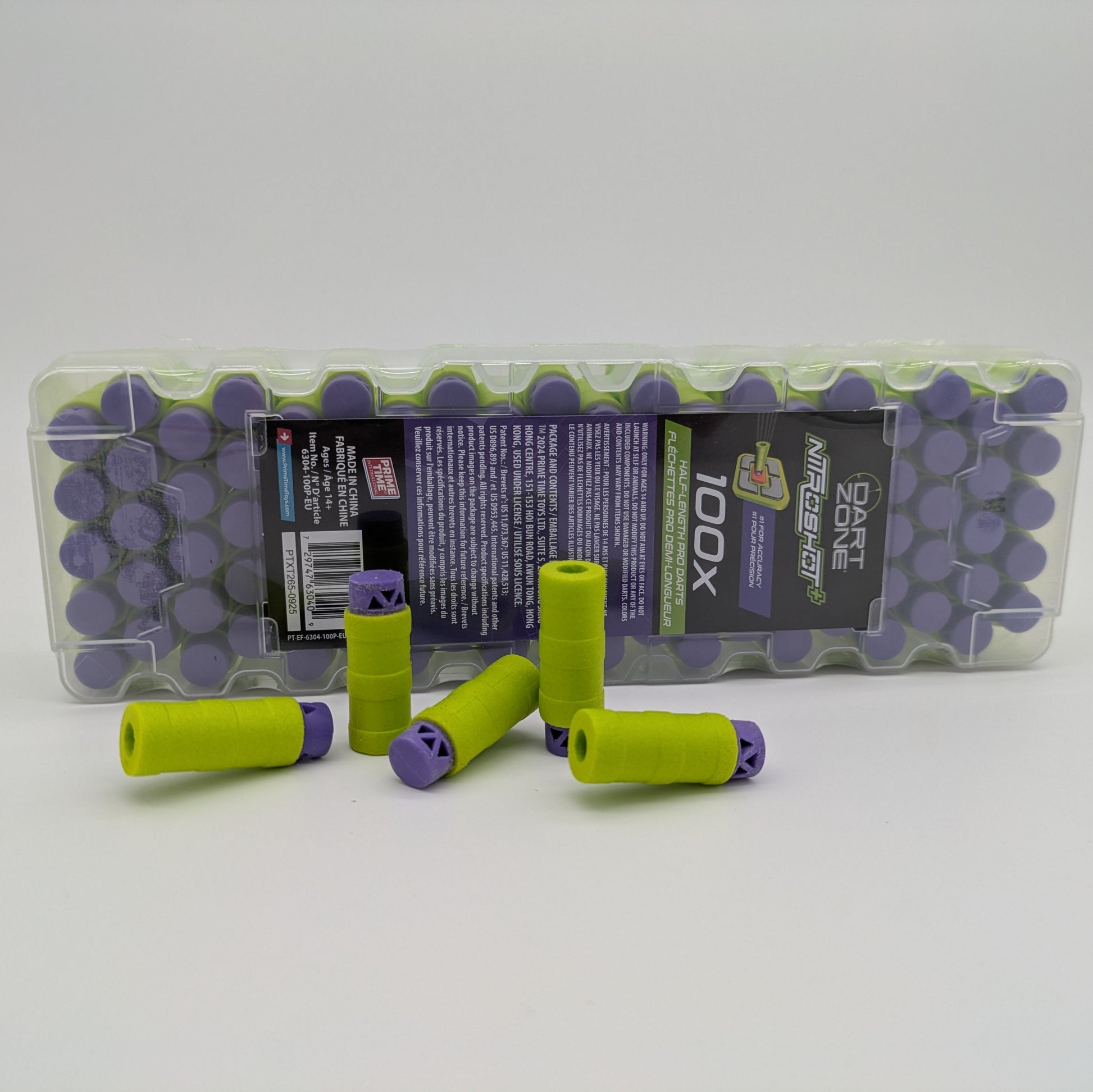 Green and purple darts with a clear plastic packaging on a white background