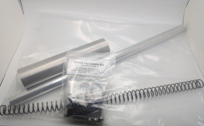 Ontos hardware kit with spring, Metal Plunger, Barrel, and packaging on a white background