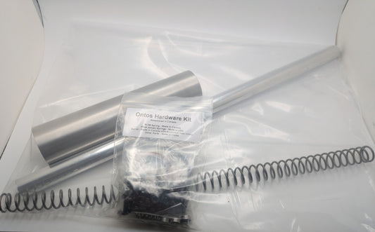 Ontos hardware kit with spring, Metal Plunger, Barrel, and packaging on a white background